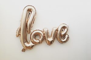 Gold balloons spelling LOVE.