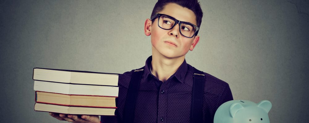 Student,Loan,Concept.,Young,Man,With,Stack,Pile,Of,Books