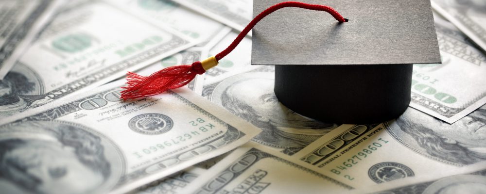 Graduation,Mortar,Board,Cap,On,One,Hundred,Dollar,Bills,Concept Graduation,Mortar,Board,Cap,On,One,Hundred,Dollar,Bills,Concept