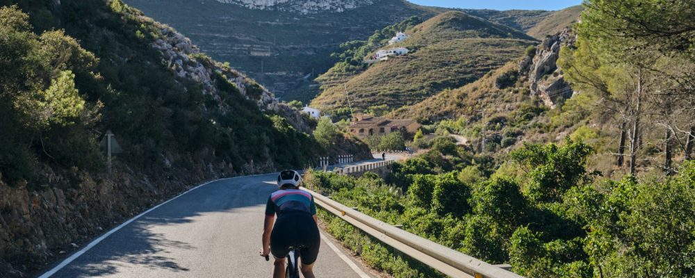 A,Woman,Cyclist,Riding,On,Mountain,Road.,Cyclist,On,The A,Woman,Cyclist,Riding,On,Mountain,Road.,Cyclist,On,The
