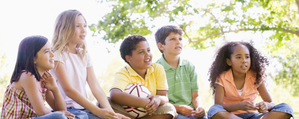 Five,Young,Friends,Sitting,Outdoors,With,Soccer,Ball Five,Young,Friends,Sitting,Outdoors,With,Soccer,Ball
