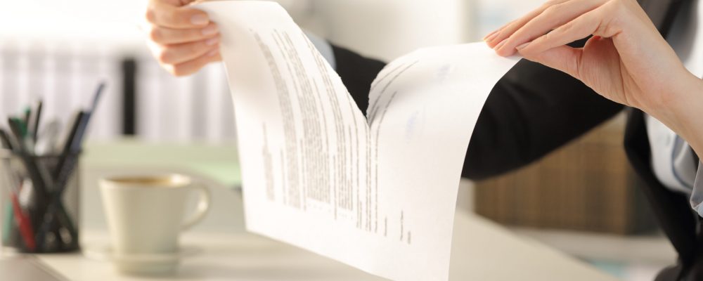 Close,Up,Of,Business,Woman,Hands,Breaking,Contract,Document,Sitting