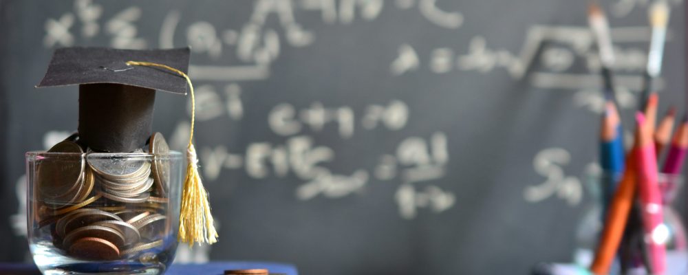 Hat,Graduation,Model,On,Money,Coins,Saving,For,Concept,Investment