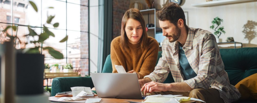 Stressful,Accounting,At,Home:,Couple,Using,Laptop,Computer,,Sitting,On
