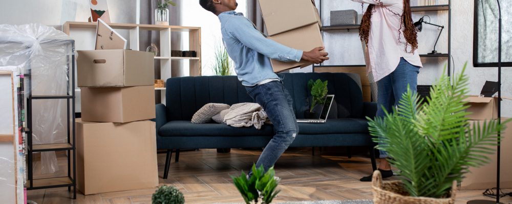 Young,African,Couple,In,Casual,Clothes,Packing,Boxes,For,Moving Young,African,Couple,In,Casual,Clothes,Packing,Boxes,For,Moving