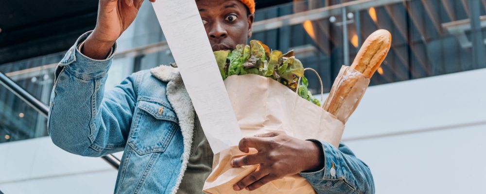 Doubting, Person,In,Denim,Jacket,Looks,At,Sales,Paper