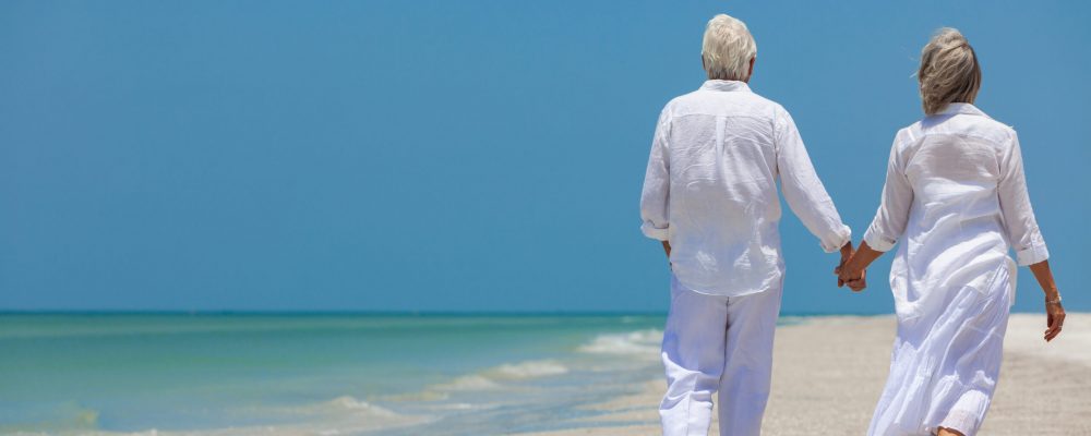 Rear,View,Of,Happy,Senior,Man,And,Woman,Couple,Walking Rear,View,Of,Happy,Senior,Man,And,Woman,Couple,Walking