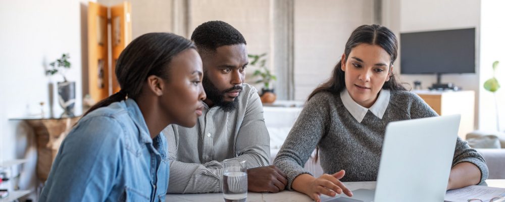 Financial,Planner,Going,Over,Savings,Plans,On,A,Laptop,With