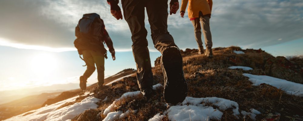 Small,Group,Of,Tourists,Walks,At,Mountain,Top,At,Sunset Small,Group,Of,Tourists,Walks,At,Mountain,Top,At,Sunset