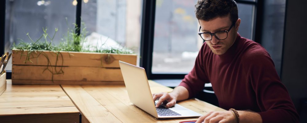 Confident,Busy,Male,Freelancer,In,Trendy,Eyewear,Doing,Remote,Job