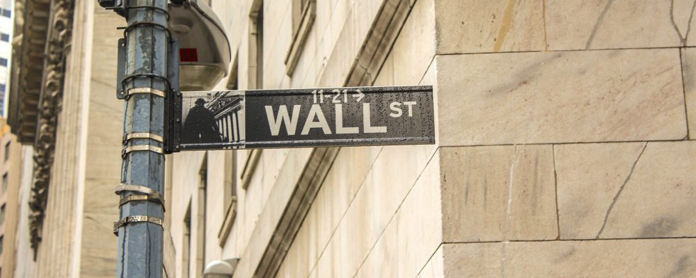 sophie-backes-UMfGoM67w48-unsplash New York street sign for Wall Street.