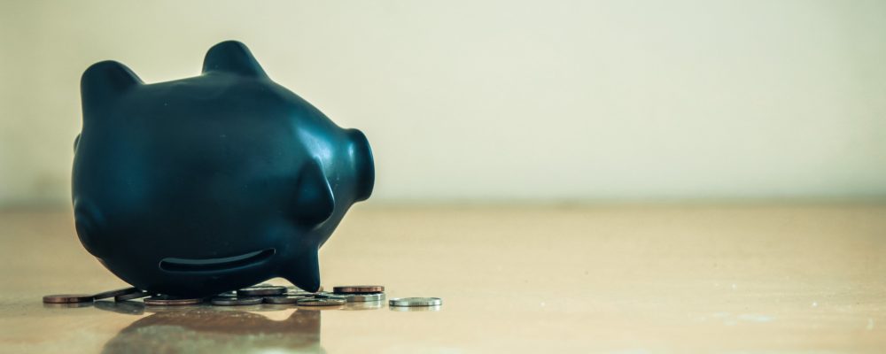 Piggy,Bank,Upside,Down,And,Coins.,Financial,Crisis,Concept.